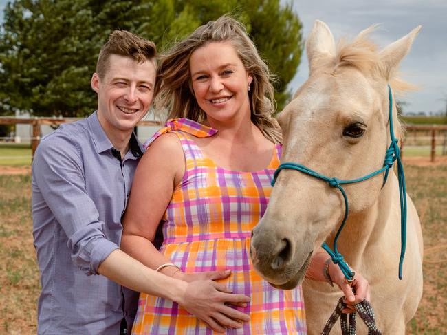 Jockey Harry Coffey with pregnant wife Tayla and horse Shakaya at their Swan Hill property. Picture: Rebecca Pilgrim