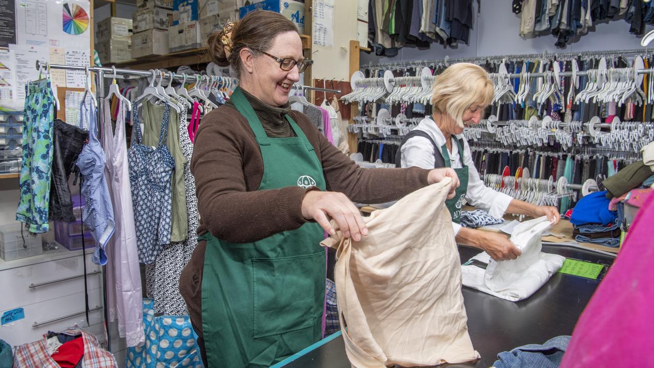 ADRA Op-shop volunteers Jodie Farquharson (left) and Leonna Lobwein sort through clothes and recently donated goods. Picture: Nev Madsen.