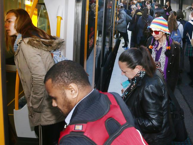 Commuters begin the search for a seat. Picture:Peter Clark