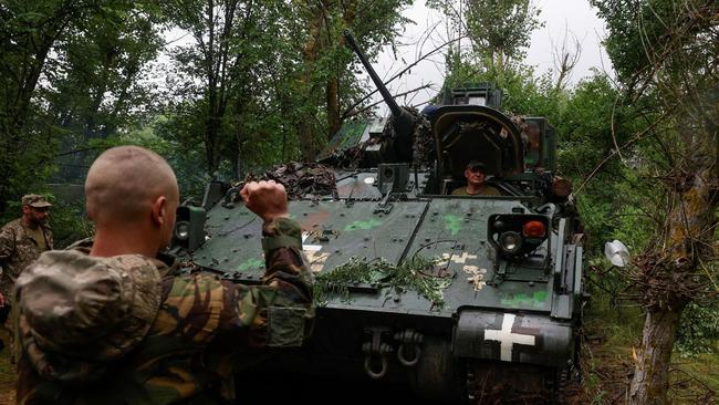 Ukrainian servicemen operate an M2 Bradley infantry fighting vehicle in the Zaporizhzhia region.