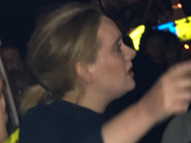 Adele is seen on the streets of London near the Grenfell Tower after a fire ripped through the building. Picture: Twitter/@FourMee