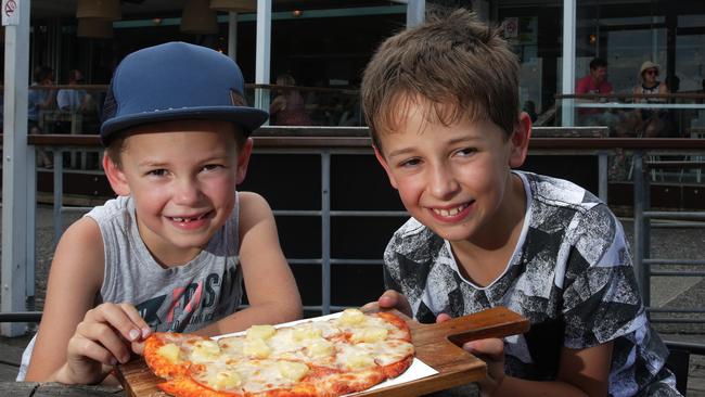 By the slice: Miller and Bailey Hadaway enjoying a ham and pineapple pizza at Manly Wharf Hotel.