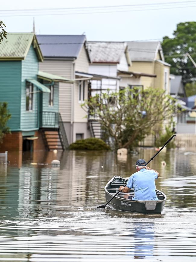 A man rows down his street. Picture: Darren Leigh Roberts