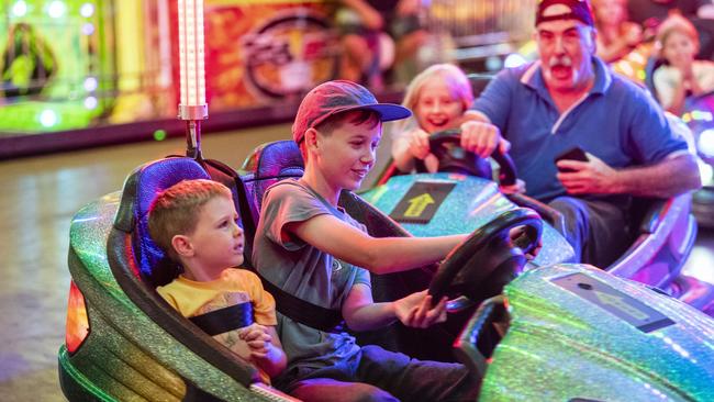 Nova Green and older brother Vincent Green get rammed by family members Ruby Hopkinson and Peter Desmond on the dodgem cars at Toowoomba Royal Show, Thursday, March 30, 2023. Picture: Kevin Farmer