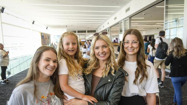 Sarah Stagg, 35, Elliot Grove, 6, Loreen Grove, 36, and Chiara Graetz, 36, get ready to board their flight to Melbourne. Picture: Roy VanDerVegt