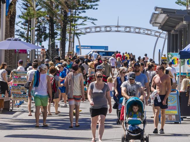 Gold Coast, Australia - September 22, 2016: View of many tourists walking along Cavill Avenue, the busiest street located in the heart of the Surfers Paradise shopping and entertainment precinct.