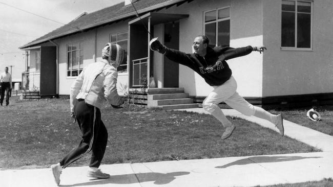 Athletes practise fencing in the village in 1956.