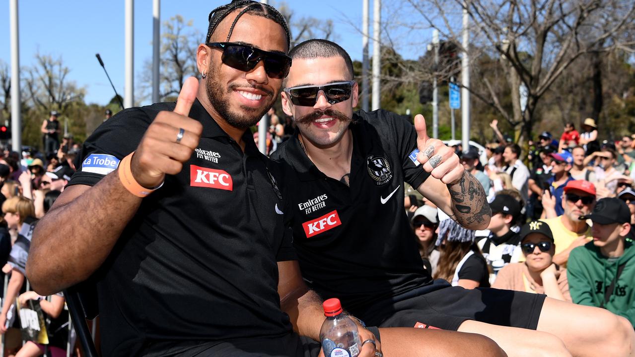 Isaac Quaynor and Oleg Markov soak up the grand final parade. Picture: Quinn Rooney/Getty Images