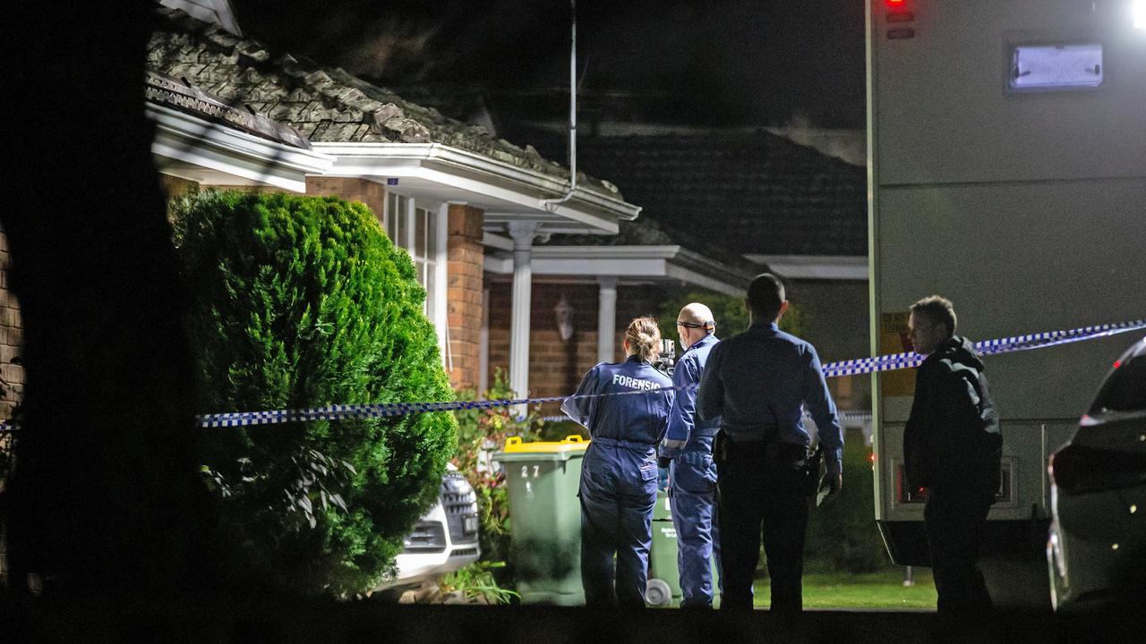 The scene outside the single-storey brick home was taped off by police. Picture: Sarah Matray