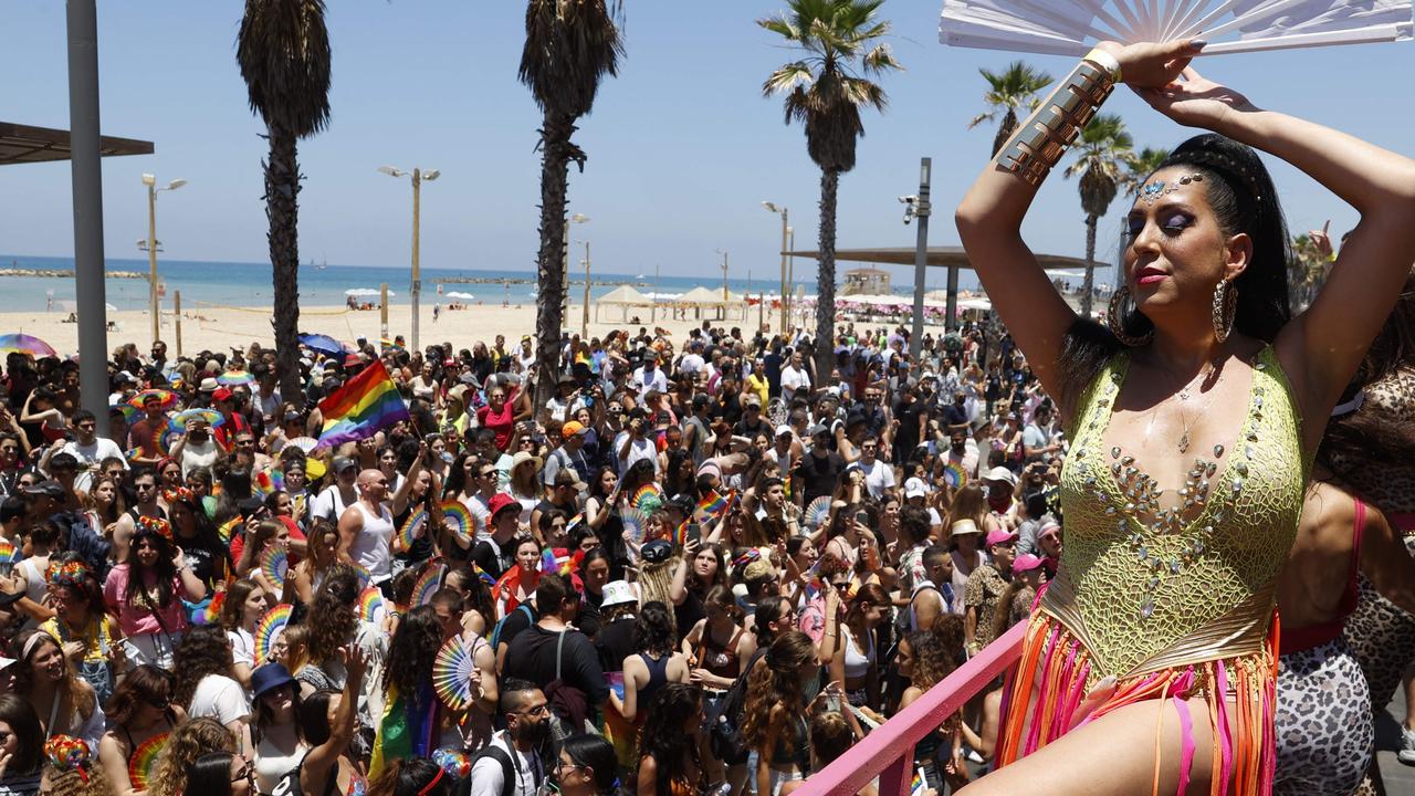 Israelis attend a Tel Aviv pride event in June, despite officials urging the wearing of masks due to a surge in infections. Picture: Jack Guez/AFP