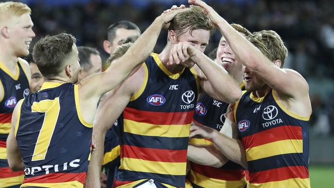 Crows Alex Keath is congratulated by team-mates after  he was named the Showdown medalist. Picture Sarah Reed