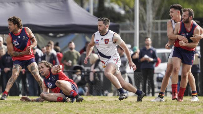 SFL: Chelsea Heights and Caulfield Bears chase the ball. Picture: Valeriu Campan