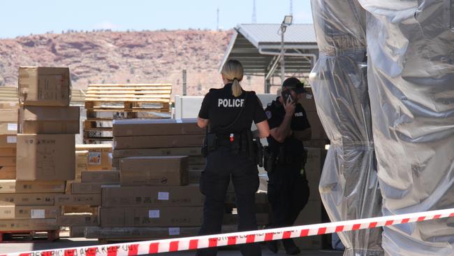 Northern Territory police blocked off the Harvey Norman warehouse on Smith St, Alice Springs, on Tuesday February 4. Picture: Gera Kazakov