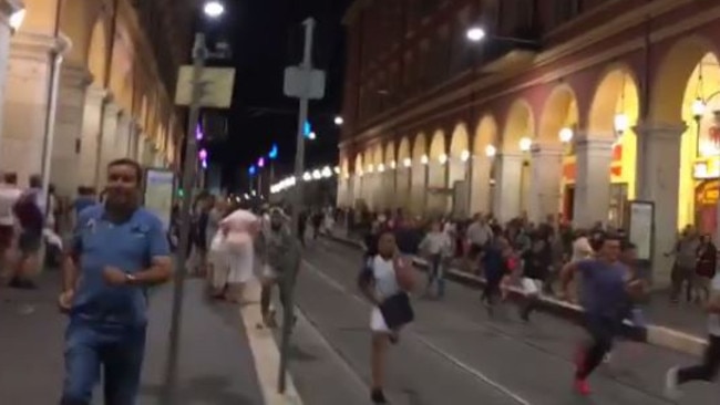 Crowds flee the scene of an attack in the French city of Nice after a truck hit a crowd of people celebrating Bastille Day. Source: Instagram