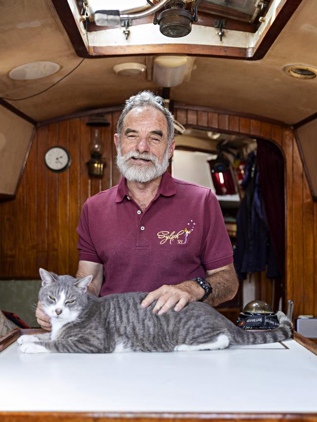 SYDNEY, AUSTRALIA, NOVEMBER 22, 2023. Sylph VI skipper and owner Robert â€˜Bobâ€™ Williams with his cat Oli who will sail with Bob in the Sydney to Hobart yacht race on board Sylph VI. Photographer: Adam Yip