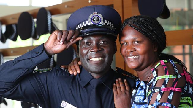 South Sudanese migrant Dr Juma Abuyi with his wife Jane Juma graduating from South Australia’s community constable program last year. (Pic: Tait Schmaal)