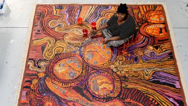 Artist Nyunmiti Burton in a promotion for the National Gallery of Australia exhibition Ngura Pulka – Epic Country.