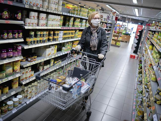 A woman does her shopping in a Berlin supermarket. Germany is looking at easing lockdown restrictions. Picture: APi