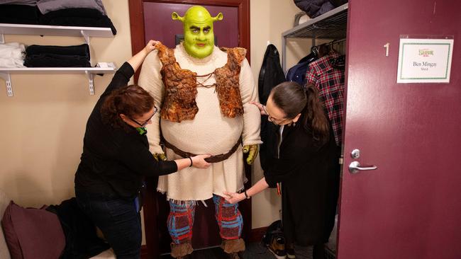 Helen Radbone and Maree Mackenzie help Ben with his costume. Picture: Mark Stewart