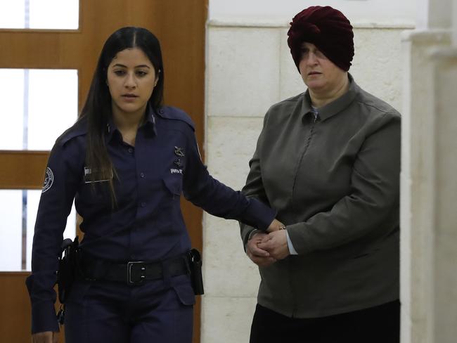 Malka Leifer, a former Australian teacher accused of dozens of cases of sexual abuse of girls at a school, arrives for a hearing at the District Court in Jerusalem on February 27, 2018, - Israel on February 12 arrested the Australian woman who is wanted in her home country on child sex abuse charges, police announced. The suspect has been living in a West Bank settlement for the past decade following a complaint filed against her by a former student at a Jewish ultra-Orthodox school she ran in Melbourne. (Photo by AHMAD GHARABLI / AFP)