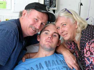 HOME FOR LIFE: Chrys Barker can now enjoy life at home with parents Allan and Betty, after receiving a record $20 million in damages after he suffered a severe brain injury in a car crash. Picture: Liam Kidston