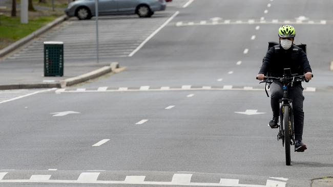 A cyclist in South Melbourne has the road to himself. Picture: Andrew Henshaw