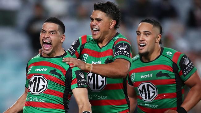 SYDNEY, AUSTRALIA - MARCH 25: Cody Walker of the Rabbitohs celebrates with Latrell Mitchell and Keaon Koloamatangi of the Rabbitohs after scoring a try during the round three NRL match between the South Sydney Rabbitohs and the Sydney Roosters at Accor Stadium, on March 25, 2022, in Sydney, Australia. (Photo by Matt King/Getty Images)