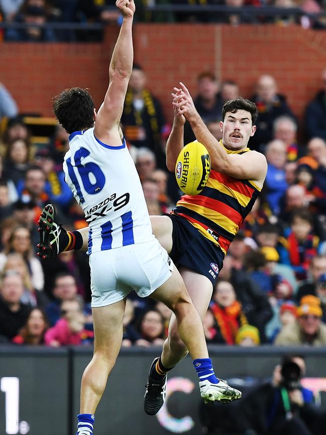 Mitch McGovern flies for a mark with Scott Thompson. Picture: Mark Brake/Getty Images