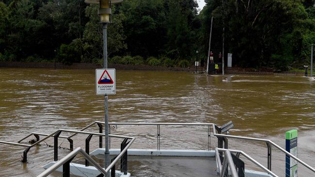 The submerged footpath at Parramatta’s Charles St weir and ferry wharf yesterday. Picture: Bianca De Marchi