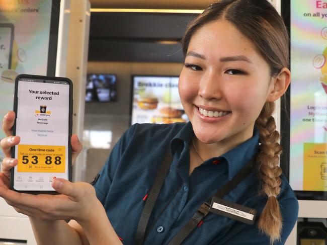 A new mobile app is to be trialled by Maccas, which enables customers to earn rewards, similar to the Qantas rewards system. Macca's Trainer, Hwang Young demonstrates the app. 21 October 2021. Picture Dean Martin