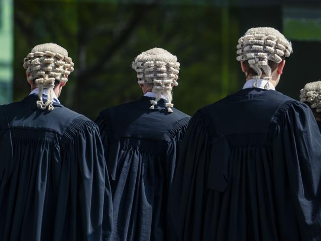 Barristers are seen outside, Supreme Court in Brisbane, Monday, October 14, 2019. (AAP Image/Glenn Hunt) NO ARCHIVING