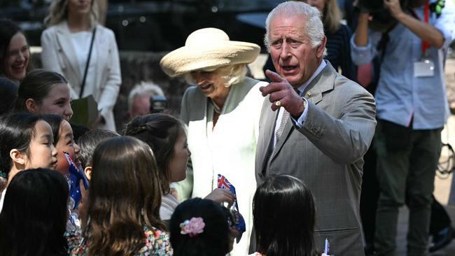 The Queen wore a pale green Anna Valentine dress and straw hat. Picture: AFP