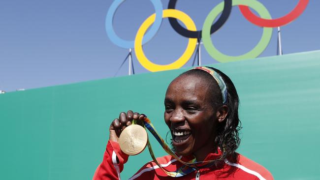 Jemima Sumgong poses with her gold medal in Rio.