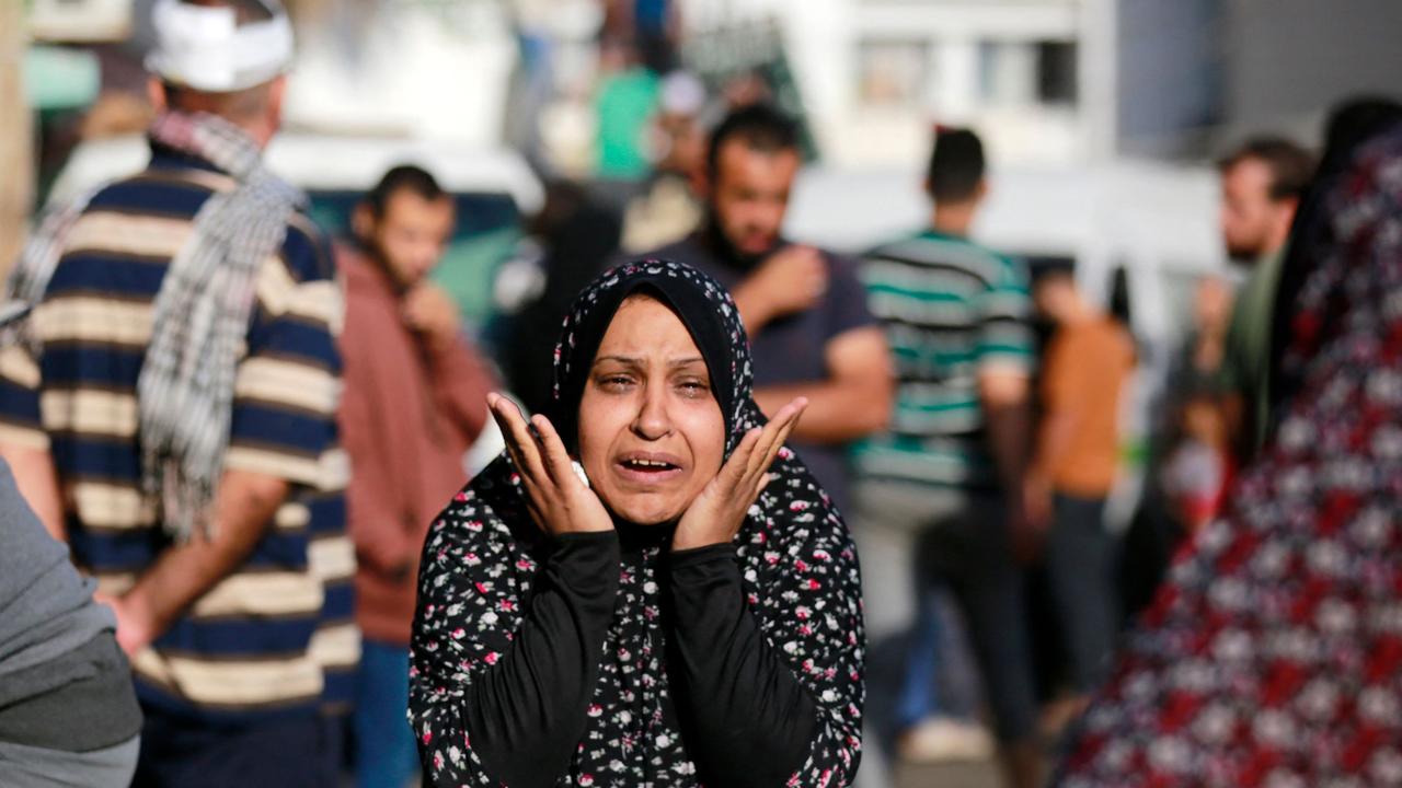 The relative of a victim killed a day earlier in an Israeli strike that hit the entrance of Al-Shifa hospital in Gaza City, reacts during a funeral held for the victims. Picture: AFP