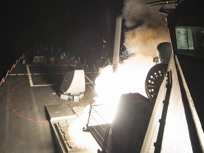 The USS Ross fires a tomahawk land attack missile at a Syrian air force airfield during last year’s strike. Picture: Mass Communication Specialist 3rd Class Robert S. Price/AFP