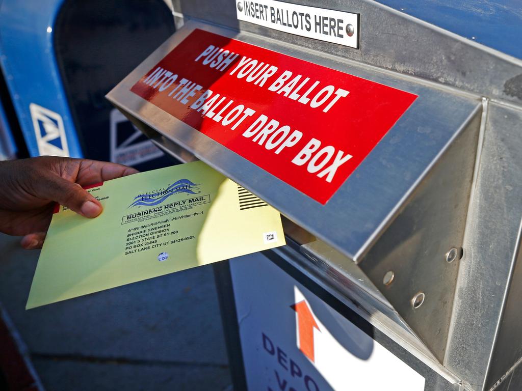 A voter dropping off his mail in ballot at the Salt Lake County election office in Utah last week. Picture: George Frey/AFP