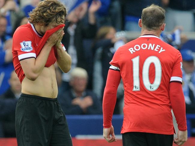 Manchetser United's Daley Blind, left, reacts after losing 5-3 to Leicester City after the English Premier League soccer match between Leicester City and Manchester United at King Power Stadium, in Leicester, England, Sunday, Sept. 21, 2014. (AP Photo/Rui Vieira)