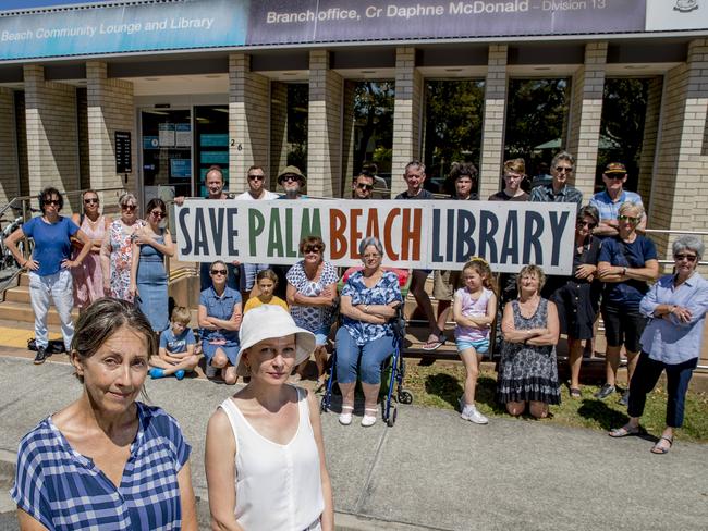 Save palm beach library movement if gaining momentum. Locals have pooled funds to hand out brochures on the matter and are hanging signs from their homes. Megan Buckley and  Trish Pilarksi and locals standing out the front of the Palm Beach Community Lounge and Library.   Picture: Jerad Williams