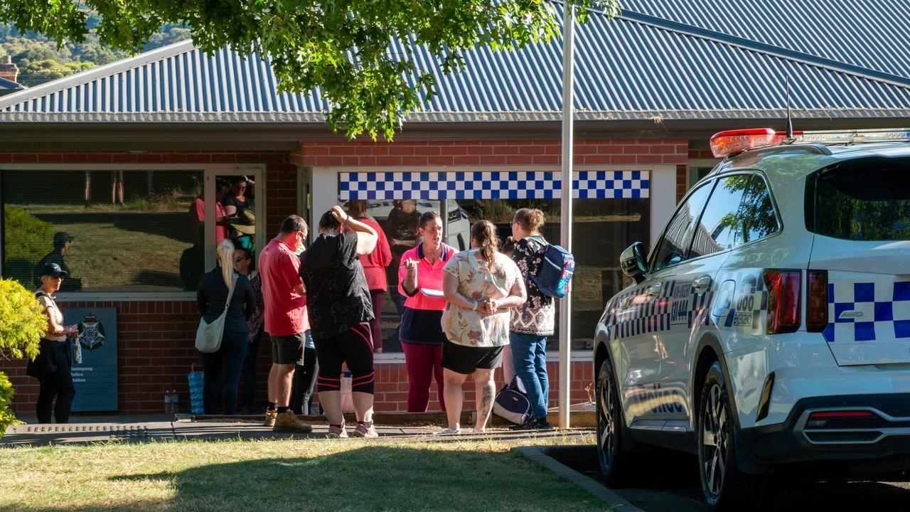 Volunteers gather near police, discussing their own plans to look for Ms Murphy as official searches begin to die down. .Picture: NCA NewsWire / Ian Wilson