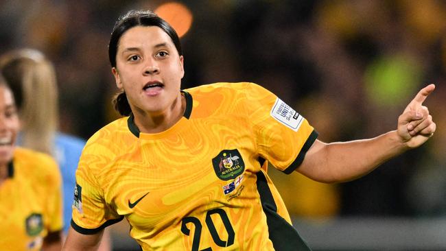 FILES-- This file photo taken on August 16, 2023 shows Australia's forward Sam Kerr celebrating scoring her team's first goal during the Australia and New Zealand 2023 Women's World Cup semi-final football match between Australia and England at Stadium Australia in Sydney. Chelsea and Australian women's football star Sam Kerr has been charged with a "racially aggravated offence" in Britain following a dispute involving a police officer, London's Metropolitan Police said March 4. The 30-year-old striker, one of the highest profile and best-paid players in the women's game, was charged following an incident in London in January 2023, a police statement read. (Photo by IZHAR KHAN / AFP)