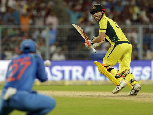 Warner watches as Ajinka Rahane dismisses him.