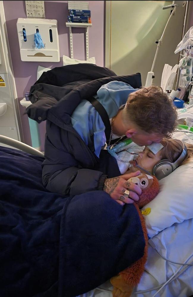 Archies brother Tom Summers kissing Archie on the head in hospital. Hollie said it is “completely barbaric and absolutely disgusting that we’re not even allowed to choose where Archie takes his last moments”. Picture: Hollie Dance/PA Wire