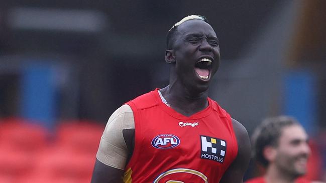 GOLD COAST, AUSTRALIA - MAY 15: Mabior Chol of the Suns celebrates a goal during the round nine AFL match between the Gold Coast Suns and the Fremantle Dockers at Metricon Stadium on May 15, 2022 in Gold Coast, Australia. (Photo by Chris Hyde/Getty Images)