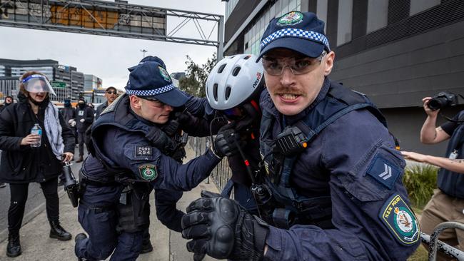 Anti-war activists clash with police. Picture: Jake Nowakowski