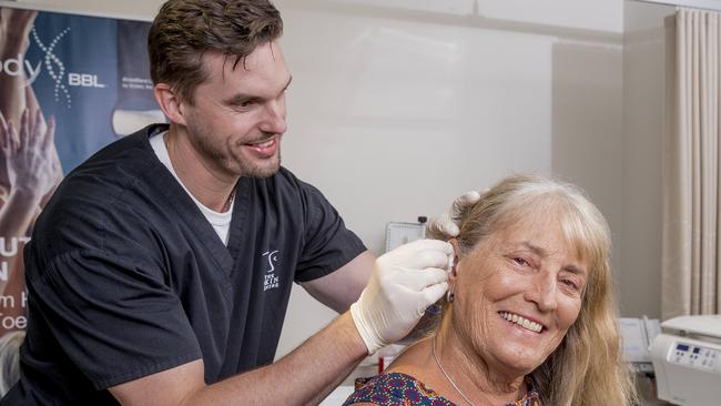 A new less invasive skin cancer treatment is available at Pindara Private Hospita. Here is specialist dermatologist Dr Andrew Freeman with one of his patients Melissa Darnley Picture: Jerad Williams