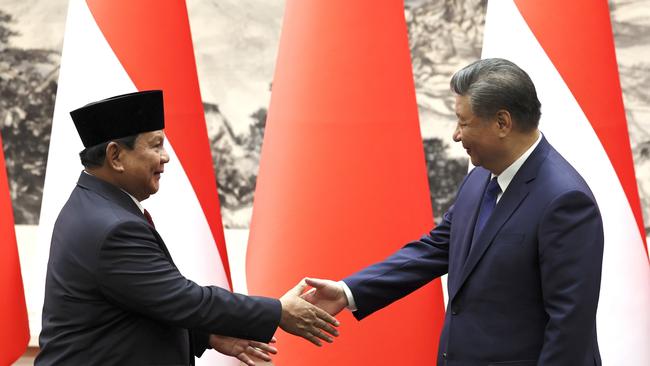 Indonesian President Prabowo Subianto, left, and Chinese President Xi Jinping shake hands during a signing ceremony at the Great Hall of the People in Beijing. Picture: Getty Images