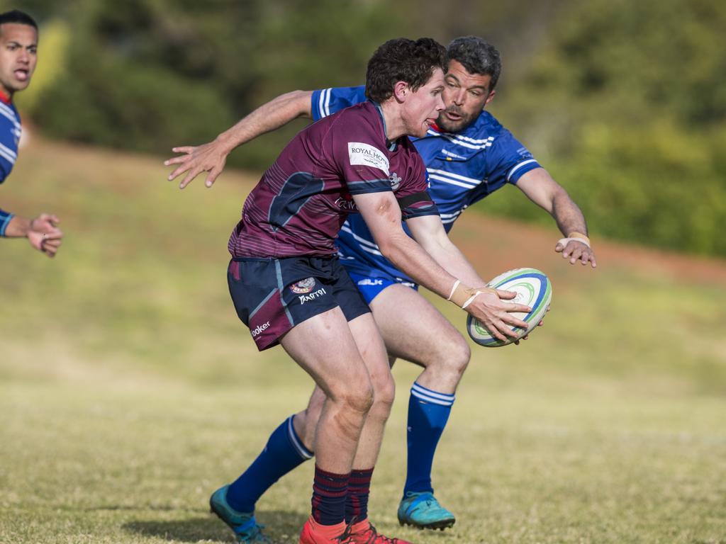 Declan Pickard of Toowoomba Bears looks to avoid 12 of USQ in Downs Rugby Risdon Cup round 11 rugby union at USQ, Saturday, June 19, 2021. Picture: Kevin Farmer