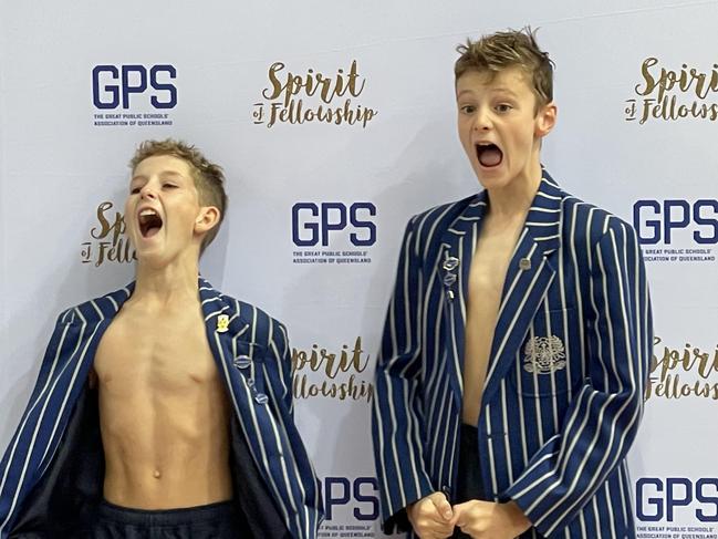 THe Nudgee junior swim captains cheer with delight after learning of their win.