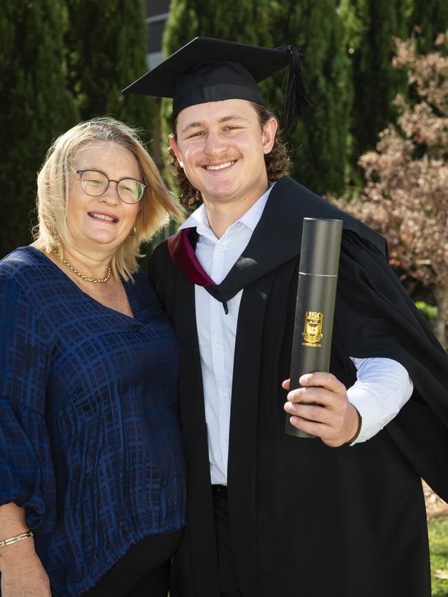 Bachelor of Spatial Science (Honours) graduate Luke Spreadborough is congratulated by his mum Karyn Stieler at the UniSQ graduation ceremony at Empire Theatres, Wednesday, June 28, 2023. Picture: Kevin Farmer