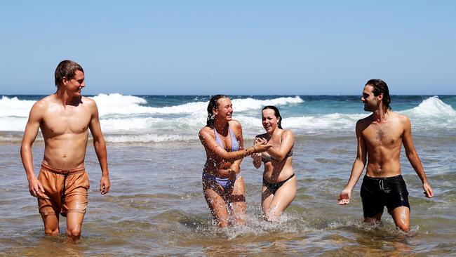 Charlie Young, 21, Lia Anderson, 20, Jasmin Livingstone, 20 and Ewan Kirk, 19, enjoying the hot weather at Turimetta Beach on Sydney‘s Northern Beaches. Picture: Tim Hunter